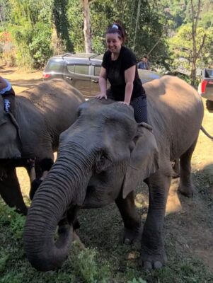 Traci riding an elephant