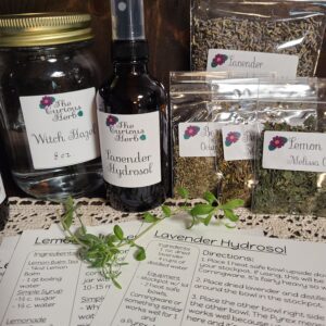 The items in this photo are products and ingredients found in the Curious Herb herbal remedies subscription box.