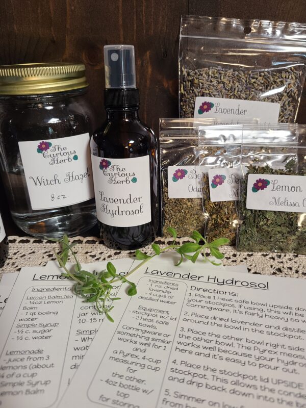 The items in this photo are products and ingredients found in the Curious Herb herbal remedies subscription box.