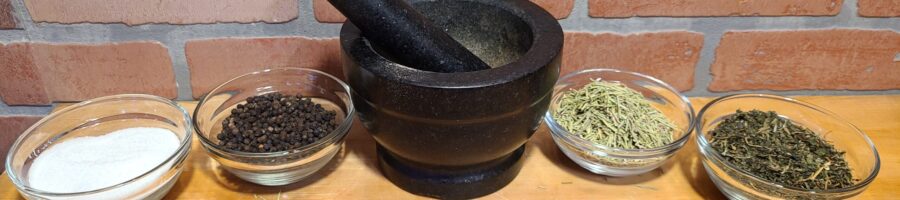 Herbs in bowls with a mortar and pestle