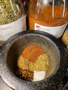 Mortar and pestle with herbs and spices